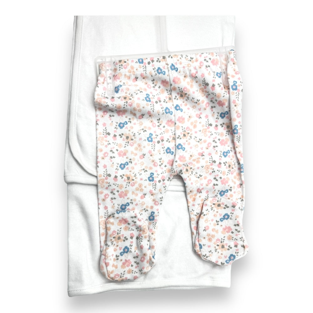 White footed trousers with matching floral print to the hat