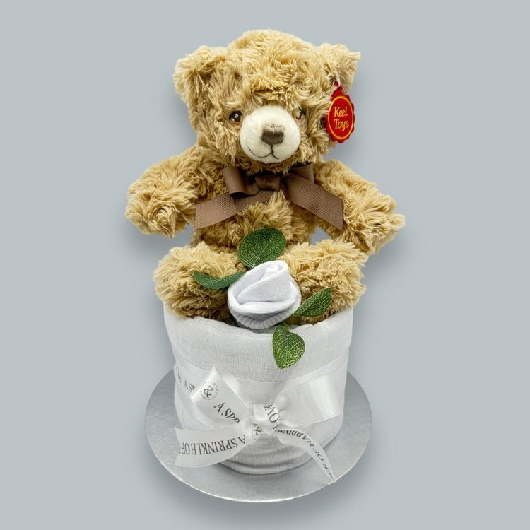 Rosebud-shaped socks on nappy cake