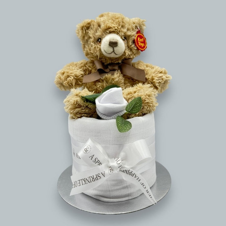 White muslin-wrapped nappy cake