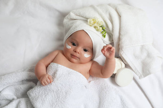 Top 5 Baby Skincare Myths Debunked: Expert Tips for Keeping Your Newborn’s Skin Healthy and Soft - Baby wrapped in towels in a spa like style