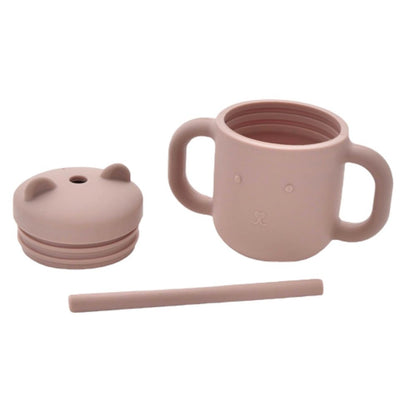 Matt pink silicone sippy cup with straw and handles