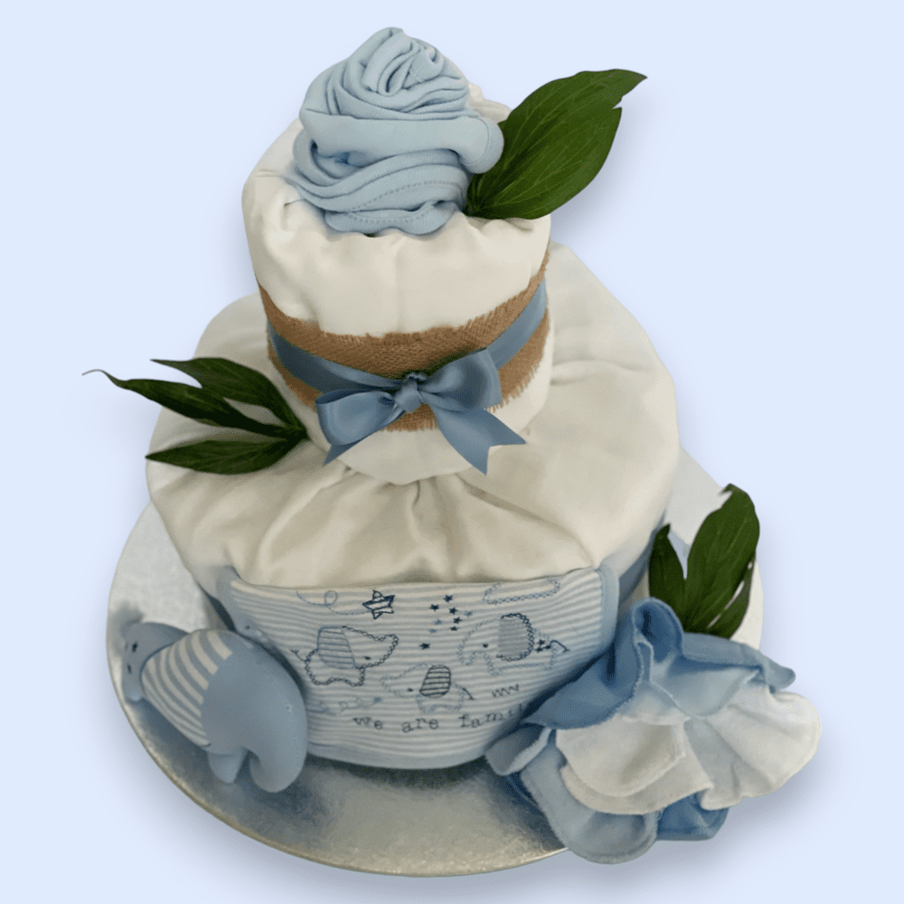 Hat and babygrow transformed into flower arrangement on 2-Tier Blue "Elephant" Nappy Cake