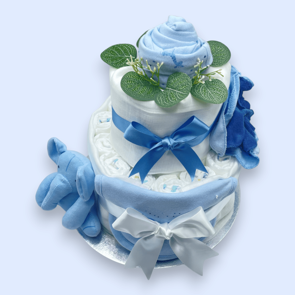 Hat and babygrow transformed into flower arrangement on 2-Tier Blue “Sitting Elephant” Nappy Cake