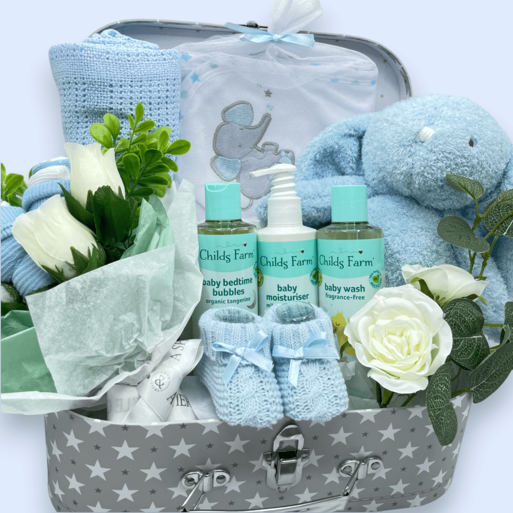 Childs Farm Baby Gift Set arranged in a stylish suitcase, ready for gifting