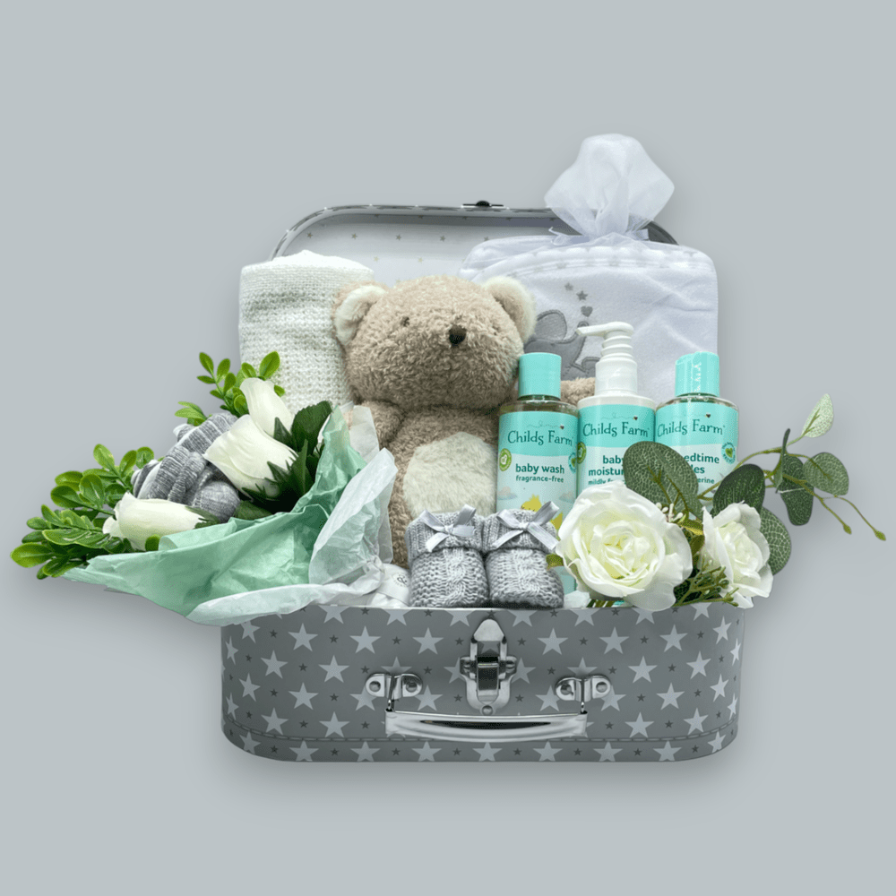 Childs Farm Baby Gift Set arranged in a stylish suitcase, ready for gifting