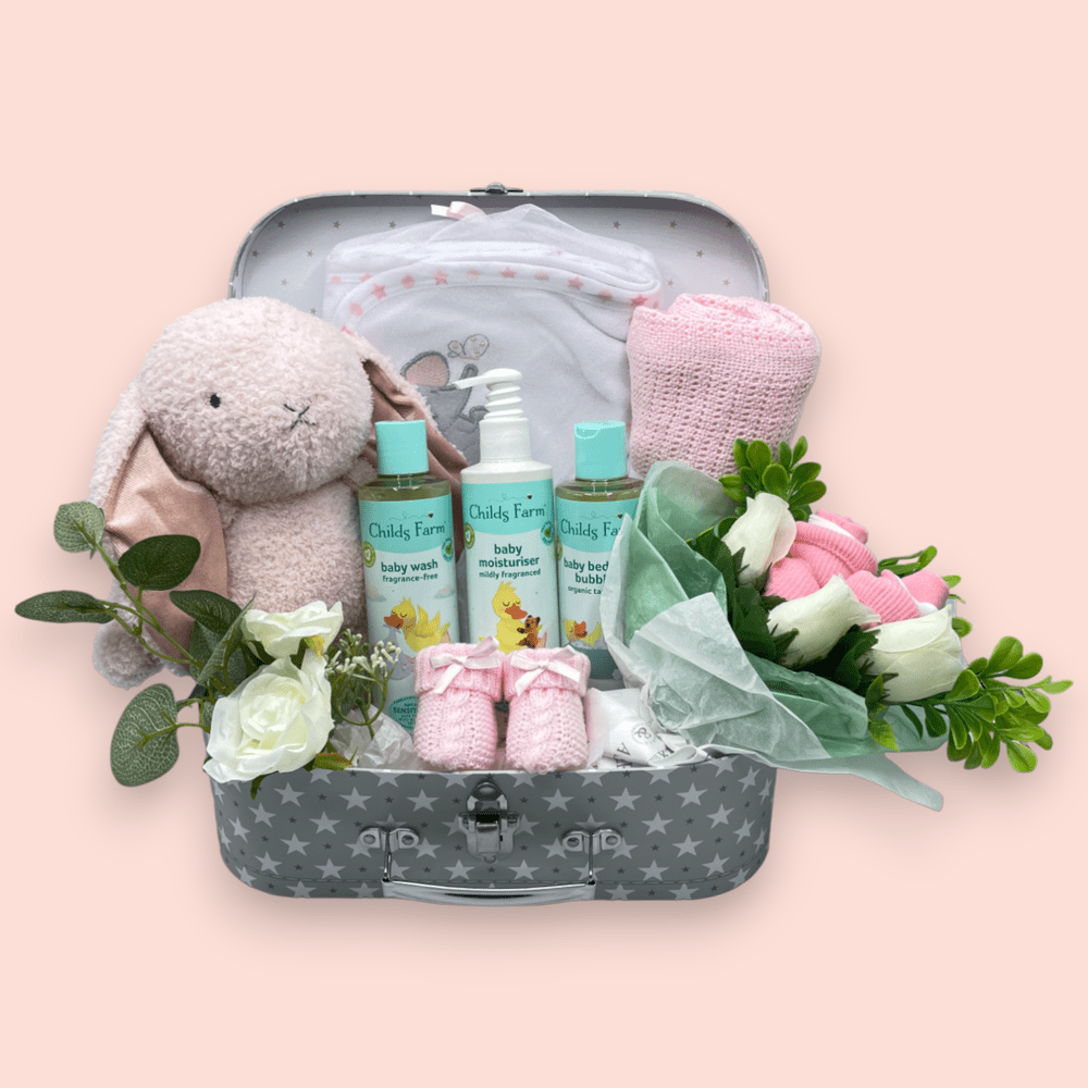 Childs Farm Baby Gift Set including a blanket, hooded towel, washcloths, socks, and a soft toy