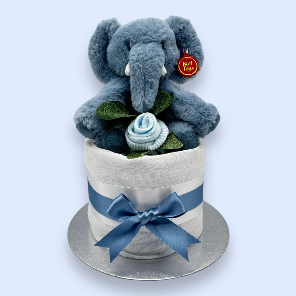 Soft white muslin wrap on the Elephant Elegance Mini Nappy Cake adding a touch of purity