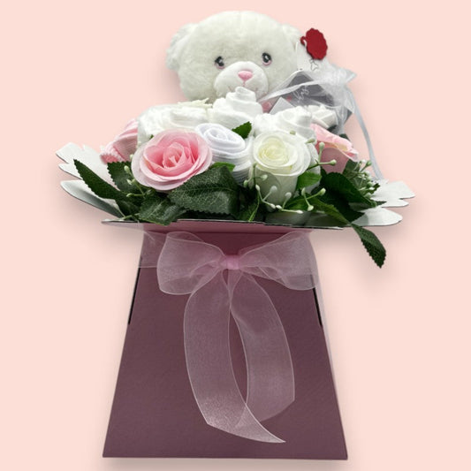 Pink Baby Blossom newborn baby girl gift box with teddy bear, nappies, baby socks and roses