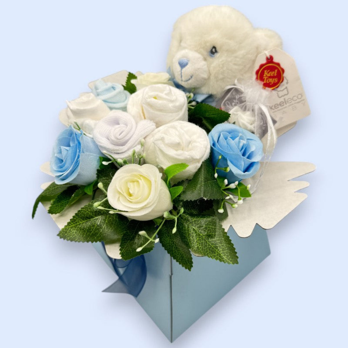 Blue baby boy gift box with Keeleco teddy, baby socks, nappies and floral details