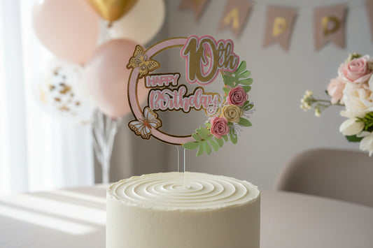 Close up of handmade floral 10th birthday cake topper with layered cardstock design