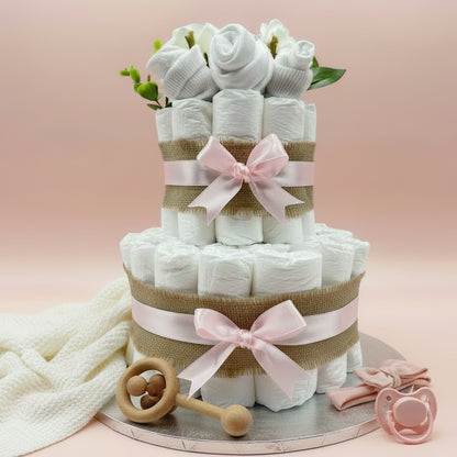 Elegant 2-tier naked nappy cake with pink ribbon and floral clothing topper