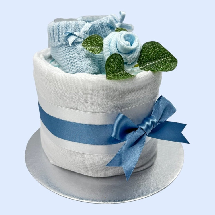 Charming baby boy mini nappy cake in blue and white with keepsake details