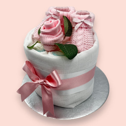 Elegant pink and white mini nappy cake for baby showers, styled by Love & Tiers