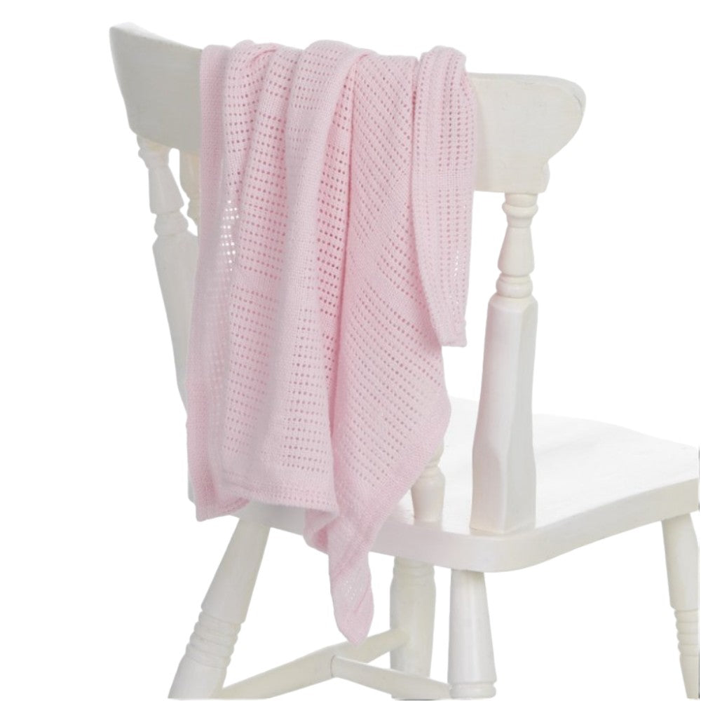 Pink cellular baby blanket styled as a new baby gift