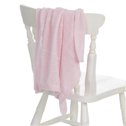 Pink cellular baby blanket styled as a new baby gift
