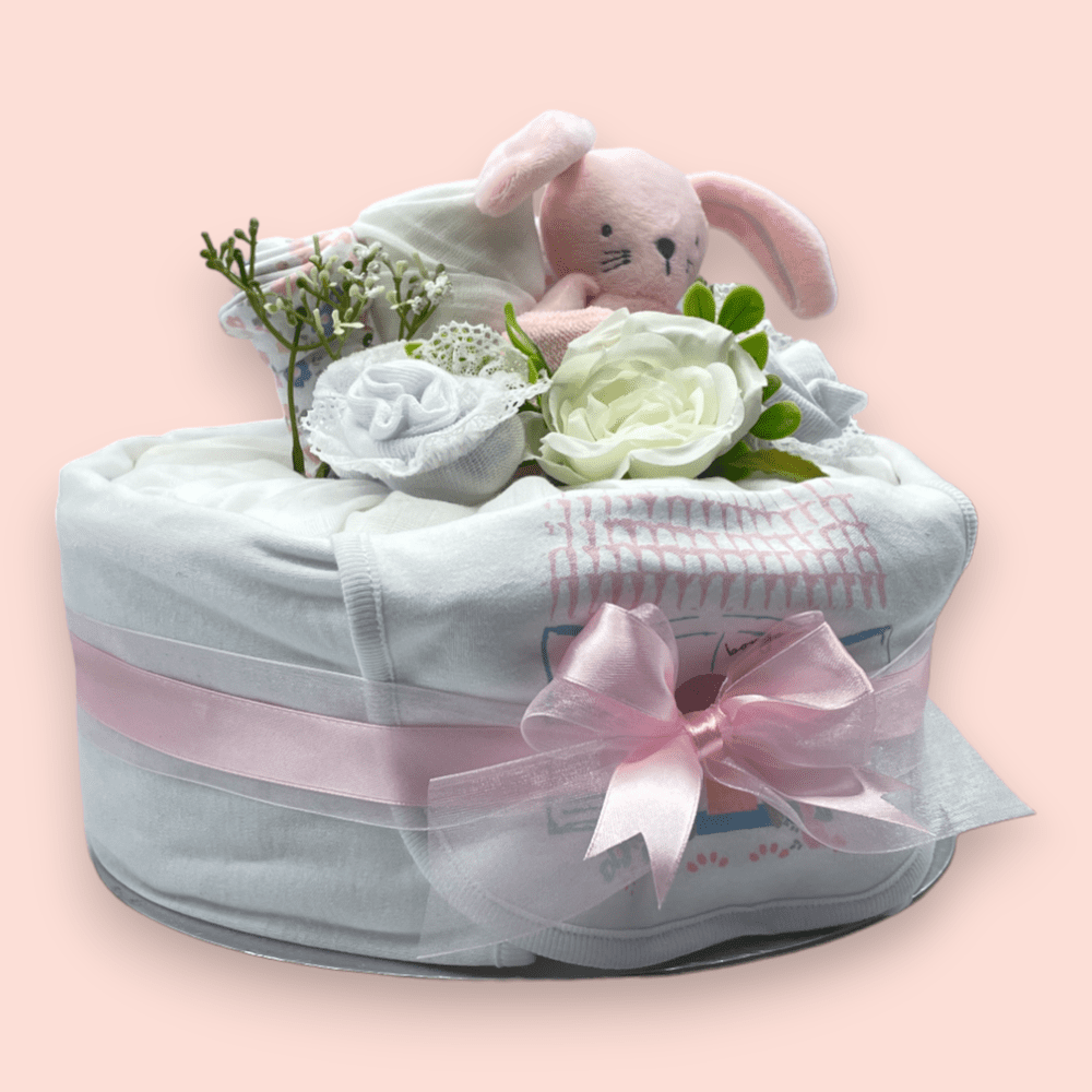 Right Side View of Pink nappy cake with muslin wrap and ribbon for newborn baby shower gift