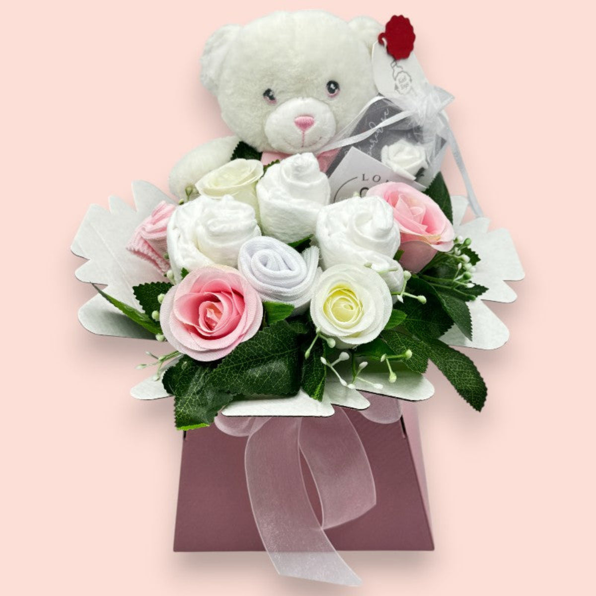 Pink baby gift box with Keeleco teddy, Pampers nappies, baby socks and pink and white roses