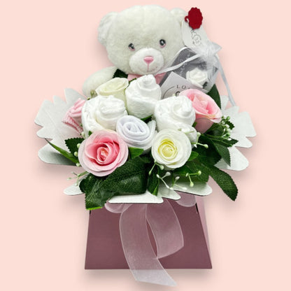 Pink baby gift box with Keeleco teddy, Pampers nappies, baby socks and pink and white roses