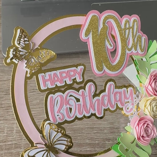 Handmade pink and gold 10th cake topper with layered text and butterflies