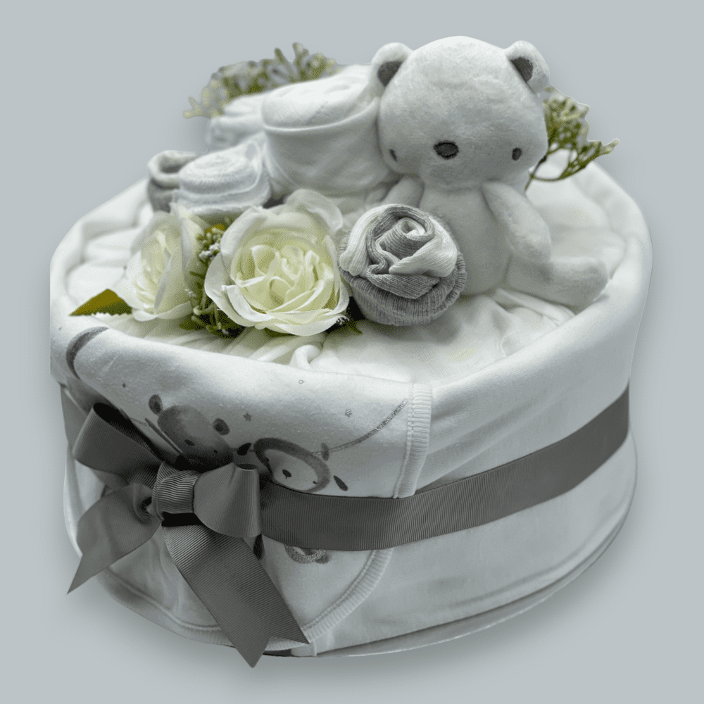 Elegant unisex baby nappy cake with clothing bouquet and soft toy