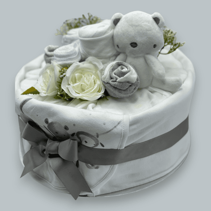 Elegant unisex baby nappy cake with clothing bouquet and soft toy