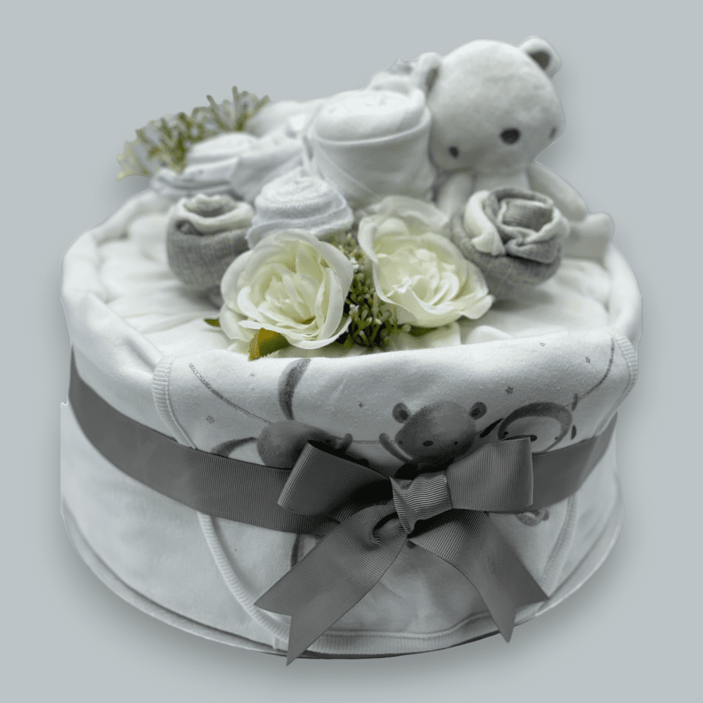 Neutral nappy cake with muslin wrap and ribbon for newborn gift