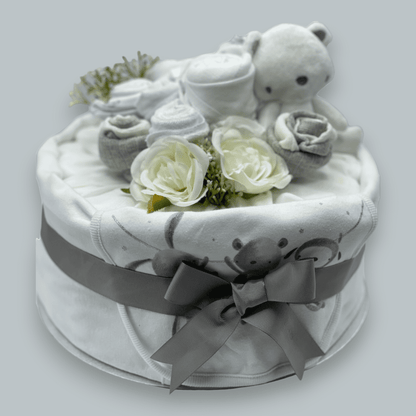 Neutral nappy cake with muslin wrap and ribbon for newborn gift
