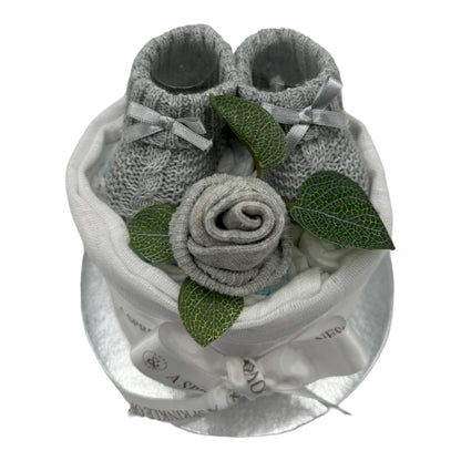 Unisex baby nappy cake with grey knitted booties, sock rose, muslin and branded ribbon