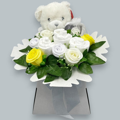 White and yellow unisex baby gift box with Keeleco teddy, Pampers nappies and baby socks